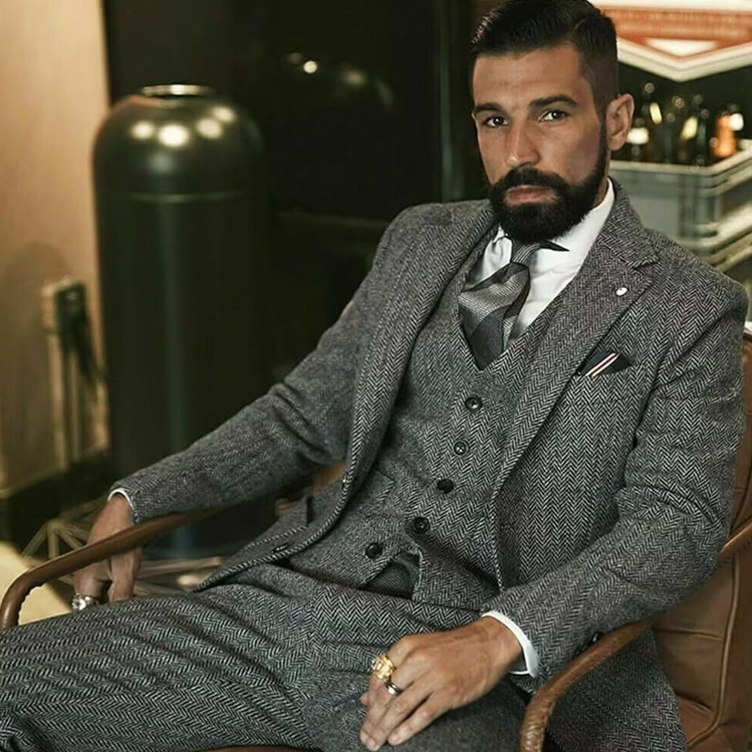 Light grey tweed suit with a modern slim-fit cut, styled for a business casual look