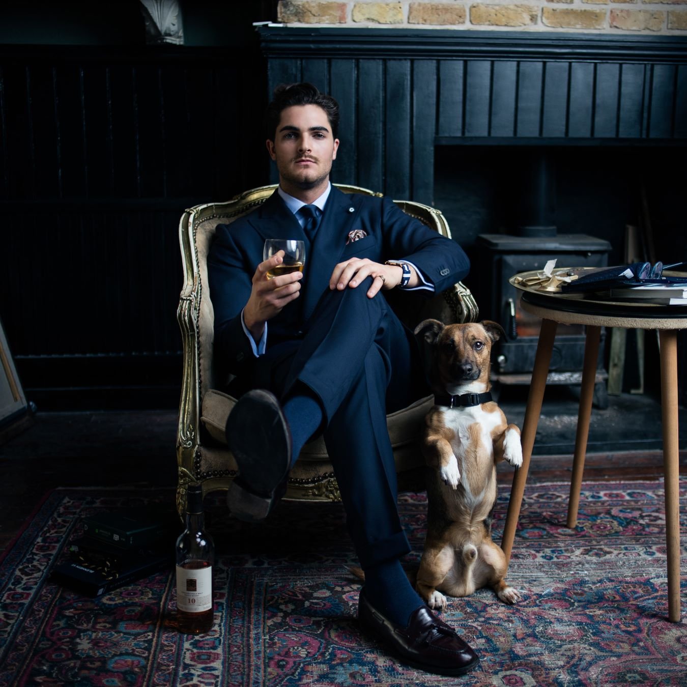 Man in a tailored business suit for work, featuring a sharp navy jacket and matching trousers.